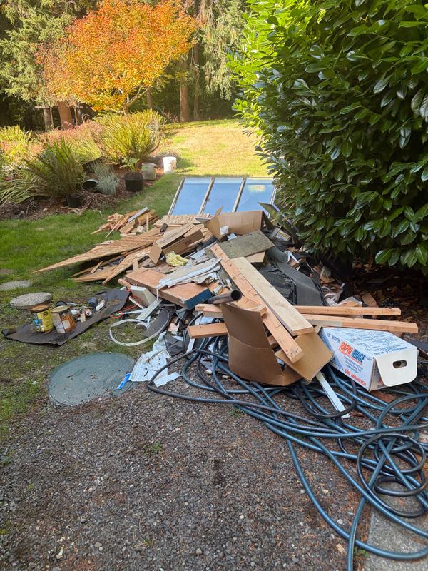 Construction debris pile removal by Classic Cleanouts (before)