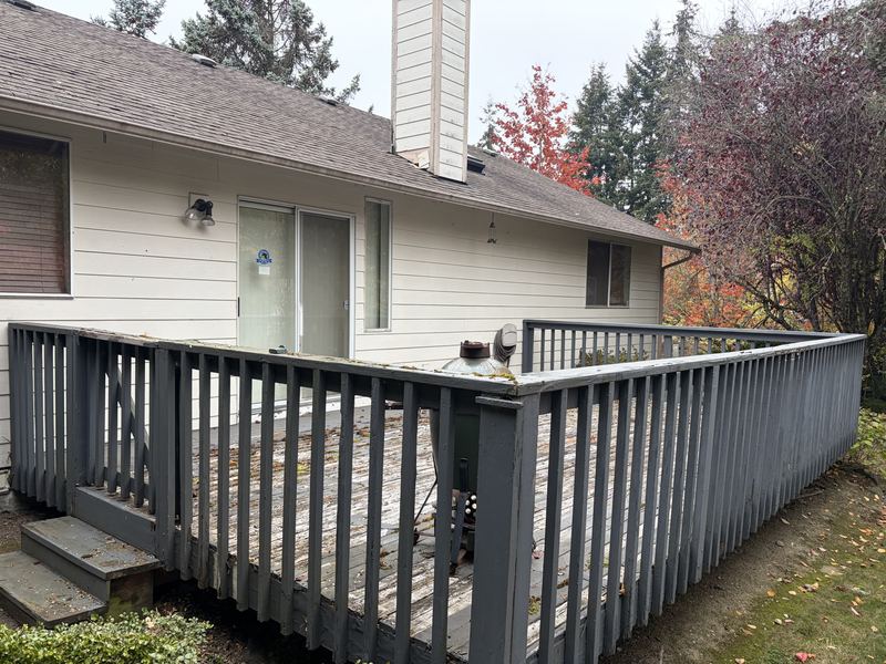 Backyard deck tear-out by Classic Cleanouts (before)